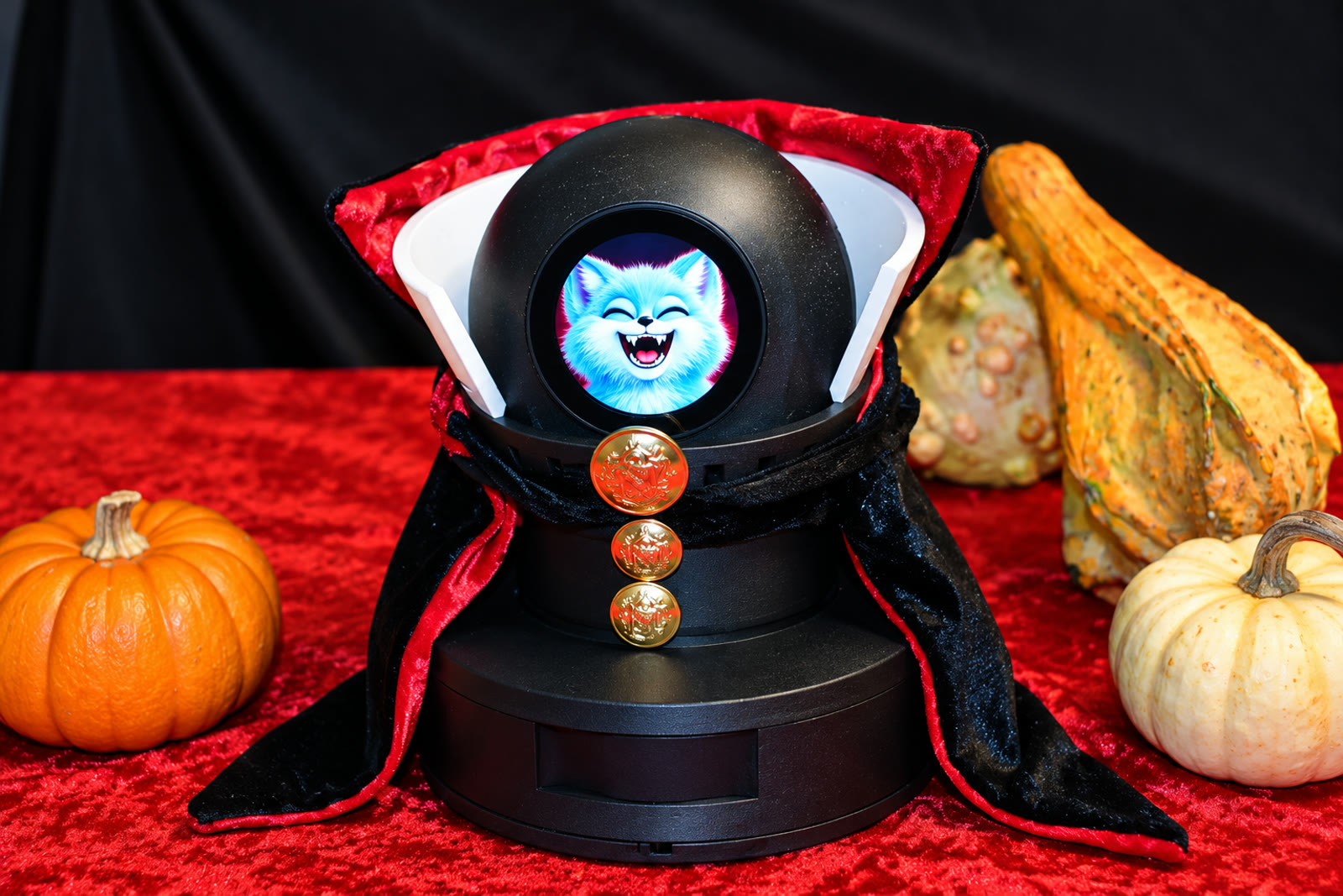 RoboFoxy Air in a vampire cape with a glowing fox face, surrounded by pumpkins